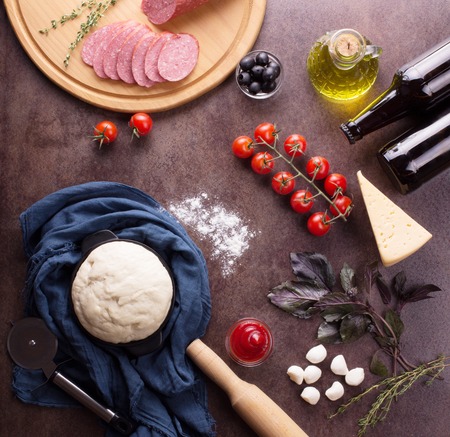 A set of fresh food for the preparation of fragrant pepperoni pizzaの写真素材