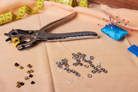 Tongs, hand tools for installing buttons for clothes and accessoriesの写真素材
