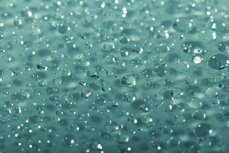 Abstract bright beautiful blue background of water dropletsの写真素材