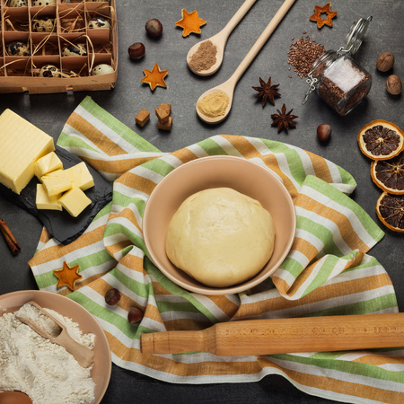 Flat lay. Set of products, fragrant spices, and fluffy yeast dough for making bunsの写真素材