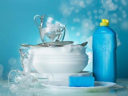 The process of dishwashing. Clean dishes in the suds and wash dishesの写真素材