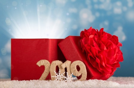 Magic gift of magic and the inscription 2019 new year in the snow on a blue backgroundの写真素材