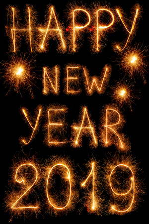 The inscription 2019 new year sparklers isolated on black backgroundの写真素材