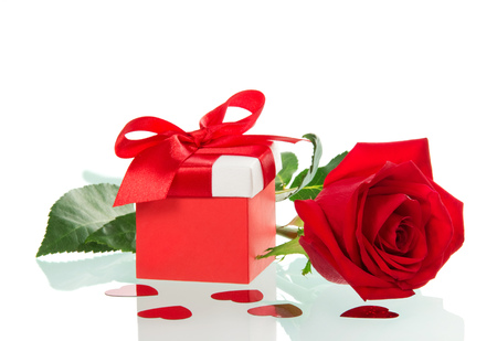 Colourful box with a gift on Valentine's day and red rose isolated on white backgroundの写真素材
