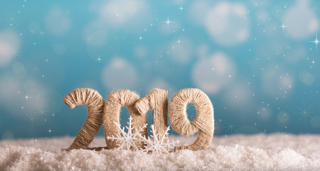 The inscription 2019 new year in the snow on a beautiful blue backgroundの写真素材