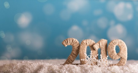 The inscription 2019 new year in the snow on a beautiful blue backgroundの写真素材