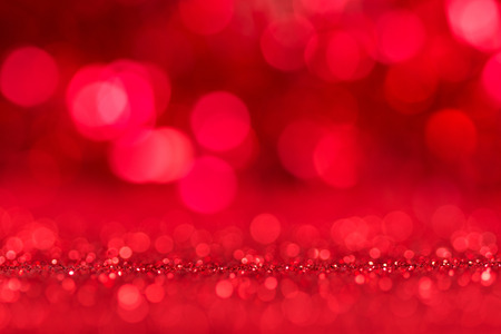Shining bright festive red background with bokeh effect