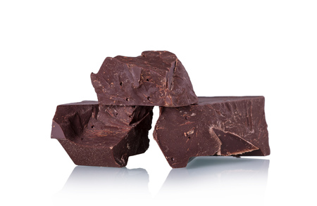 Delicious pieces of dark chocolate isolated on white backgroundの写真素材