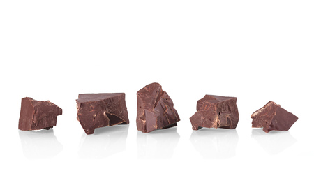 Pieces of black delicious chocolate isolated on white backgroundの写真素材
