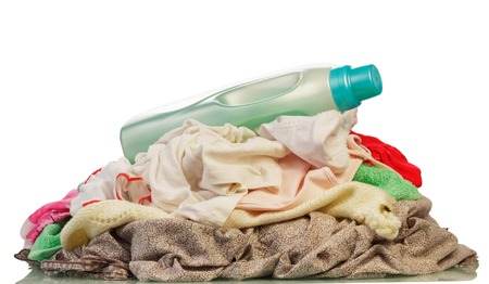 Mount the different colored dirty laundry isolated on white backgroundの写真素材