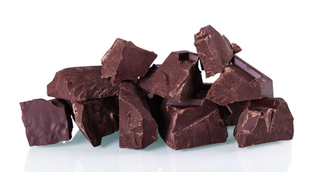 Pieces of bitter dark chocolate isolated on white backgroundの写真素材