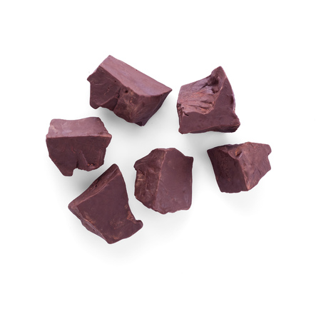 Top view. Large pieces of dark chocolate isolated on white backgroundの写真素材