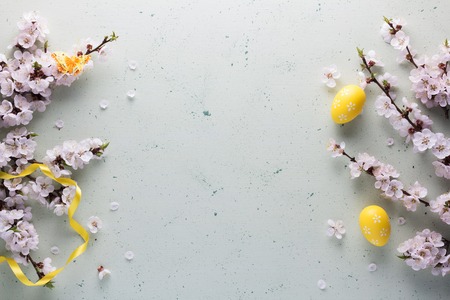 Happy Easter. Top view. Spring flowers, bright colored eggs. Light backgroundの写真素材