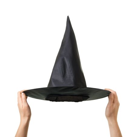 Halloween. Wizard hat in hands isolated on white backgroundの写真素材