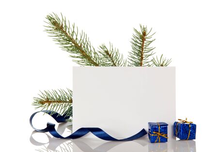 Pine sprig, gifts and blank card for greetings, isolated on white backgroundの写真素材