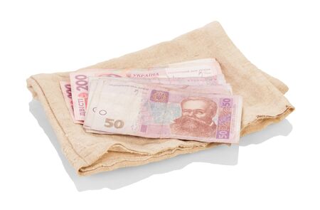 Pouch for money and hryvnia banknotes from above, isolated on white backgroundの写真素材