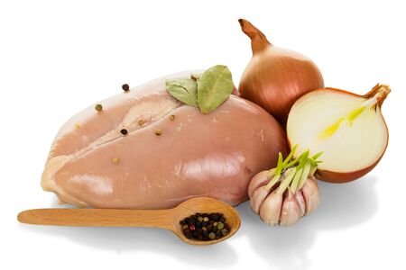 Chicken breast and spice to it, pepper in wooden spoon isolated on white backgroundの写真素材