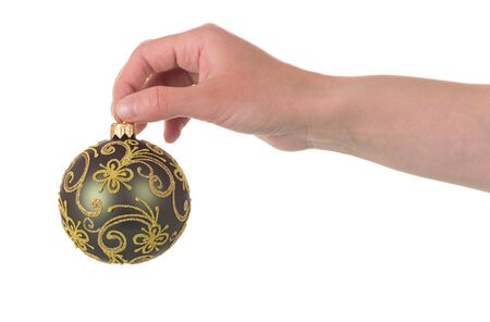Beautiful Christmas ball with a gold-painted in hand isolated on white backgroundの写真素材