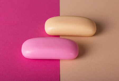 Fragrant soap of pink and beige color on the backgroundの写真素材