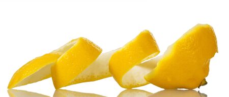Thick yellow lemon peel cutting on spiral isolated on white backgroundの写真素材