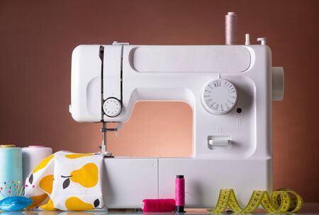 Household sewing machine, accessories, fabric under presser foot. Working processの写真素材