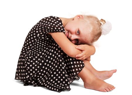 Barefoot girl in dress with pea sitting isolated on white backgroundの写真素材