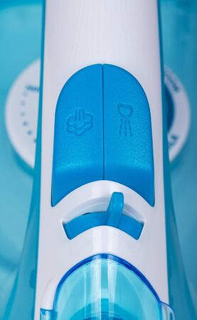 Control panel of electric iron with humidifier, close-up. Backgroundの写真素材