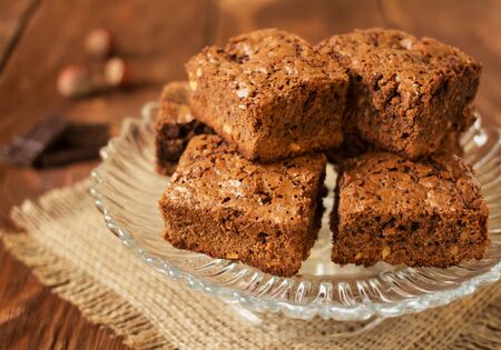Large dish with appetizing chocolate cakes on burlapの写真素材