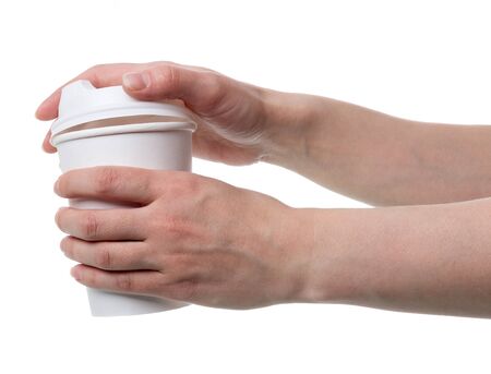 Special container for coffee with cover, in hands of woman isolated on white backgroundの写真素材
