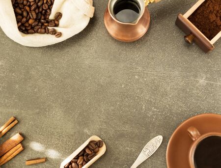 Coffee beans in bag, box of powder coffee, turka with finished drink, against gray surfaceの写真素材