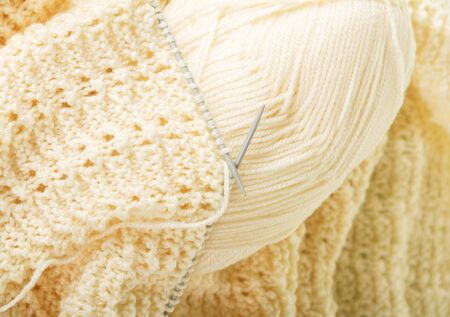 Handmade knitwear, yarn and knitting needles. Background, close-upの写真素材