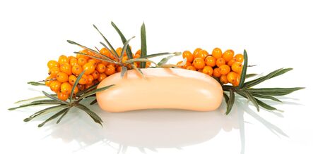Two bunches with leaves of ripe sea-buckthorn berries and soap close-up isolated on white background.の写真素材