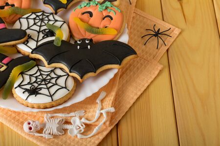 Sweets for the holiday of Halloween and spiders on wooden boardsの写真素材
