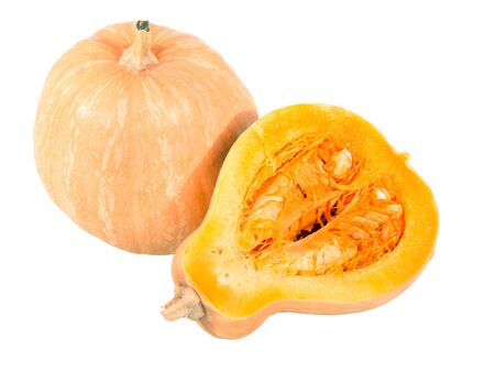 A whole pumpkin and half another close-up isolated on white background.の写真素材