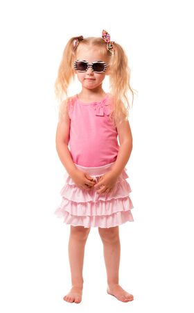 A cute little blond girl with sunglasses isolated on white background.の写真素材