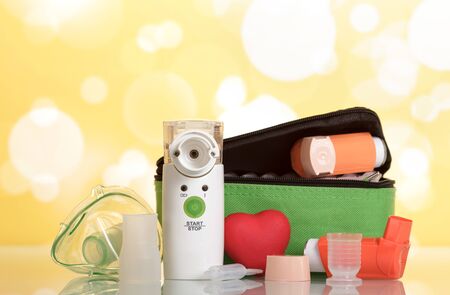 Medical equipment for inhalation, respiratory mask and ampoule with medicine on yellowの写真素材