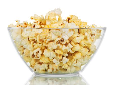 Transparent glass bowl with popcorn isolated on a white backgroundの写真素材