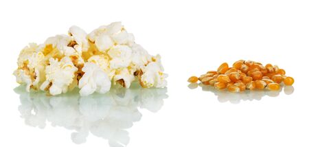 Concept. Unopened corn and ready popcorn isolated on white backgroundの写真素材