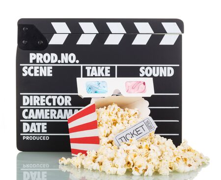 Movie clapper, popcorn and a striped box, a ticket to the movies, 3d glasses isolated on white backgroundの写真素材