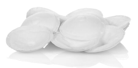 A lot of absorbent pads for breasts are isolated on white background.の写真素材