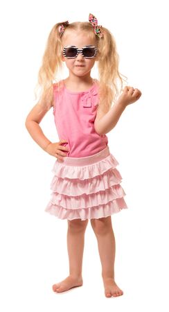 A cute little blond girl in sunglasses isolated on white background.の写真素材