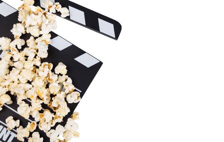 Black with white letters cinema-rattle and scattered popcorn isolated on white backgroundの写真素材