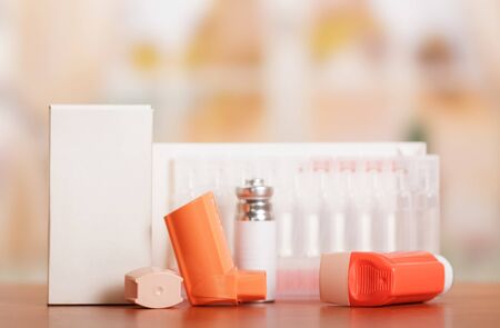 Device for inhalation and ampoules with a solution on yellowの写真素材