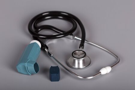 Phonendoscope and inhaler with dispenser on gray backgroundの写真素材