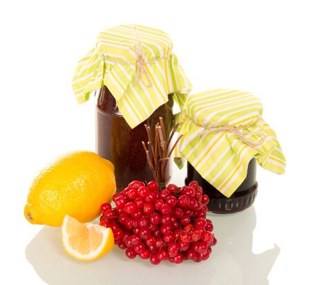 Jars with jam, bunch of viburnum, juicy lemon, isolated on white backgroundの写真素材