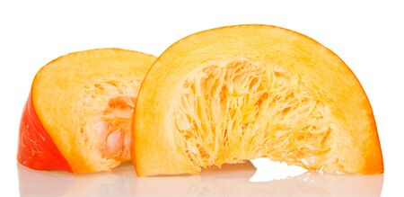 Two pieces of ripe pumpkin with seeds and pulp isolated on white background.の写真素材