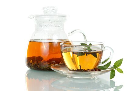 Cup of hot tea with mint and jug isolated on white backgroundの写真素材