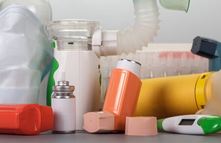 A set of devices and medicines for treatment of asthmatics, on  gray backgroundの写真素材