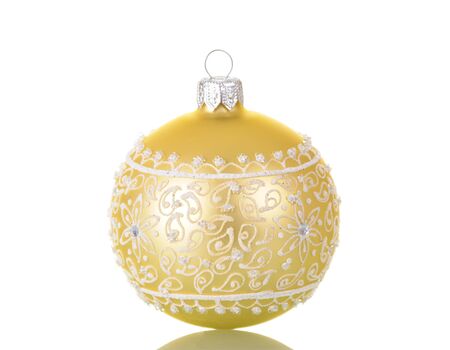 Beautiful beige ball, decorated with a silvery pattern, isolated on white backgroundの写真素材