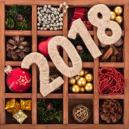Numeral 2018 on the background of box with set of Christmas decorationsの写真素材